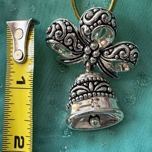 Silver Bell Pendant with Bow Design